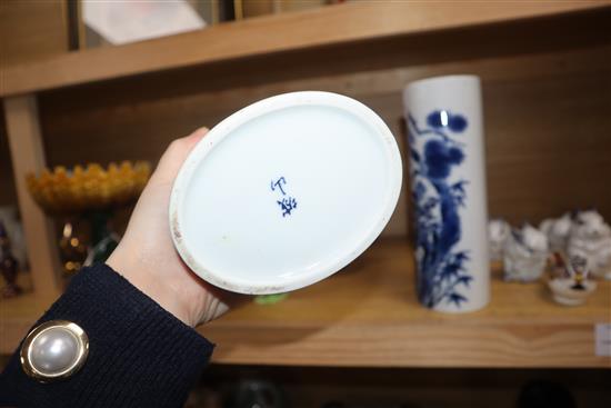 A pair of Chinese blue and white oval section sleeve vases height 25cm (one a.f.)